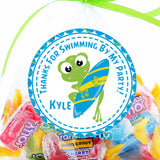 Surf frog birthday sticker with blue and yellow surfboard