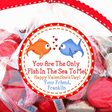 Two fish Valentine stickers with red and blue fish exchanging hearts
