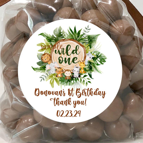 Wild one safari animals first birthday sticker design with tropical leaves