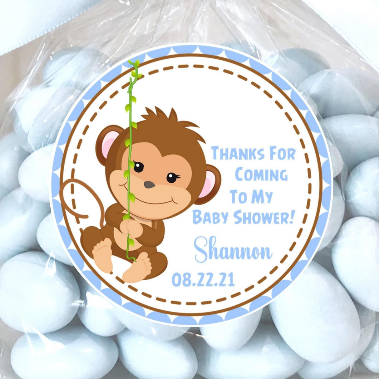 blue monkey baby shower sticker with monkey swinging on vine