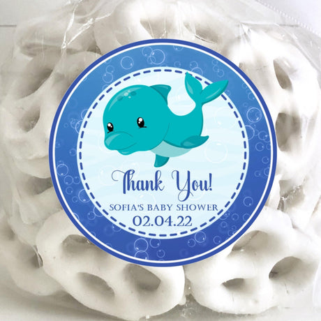 blue whale baby shower sticker with bright blue text