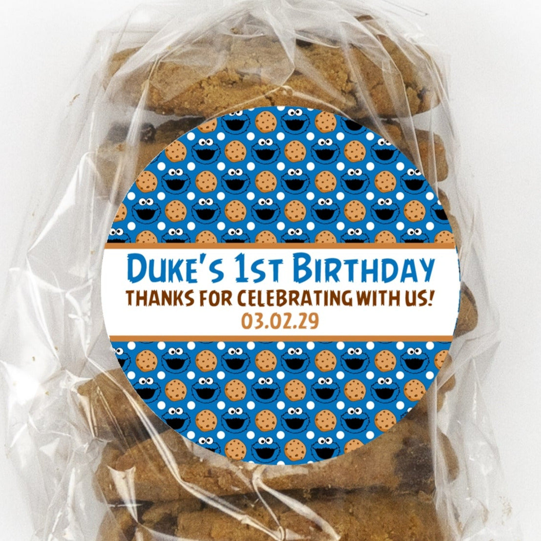 bright blue cookie birthday sticker with cookie monster style faces
