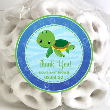 green turtle baby shower sticker with blue bubble background