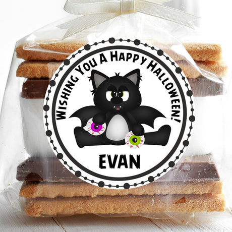 halloween sticker showing bat cat character holding colorful eyeball treats