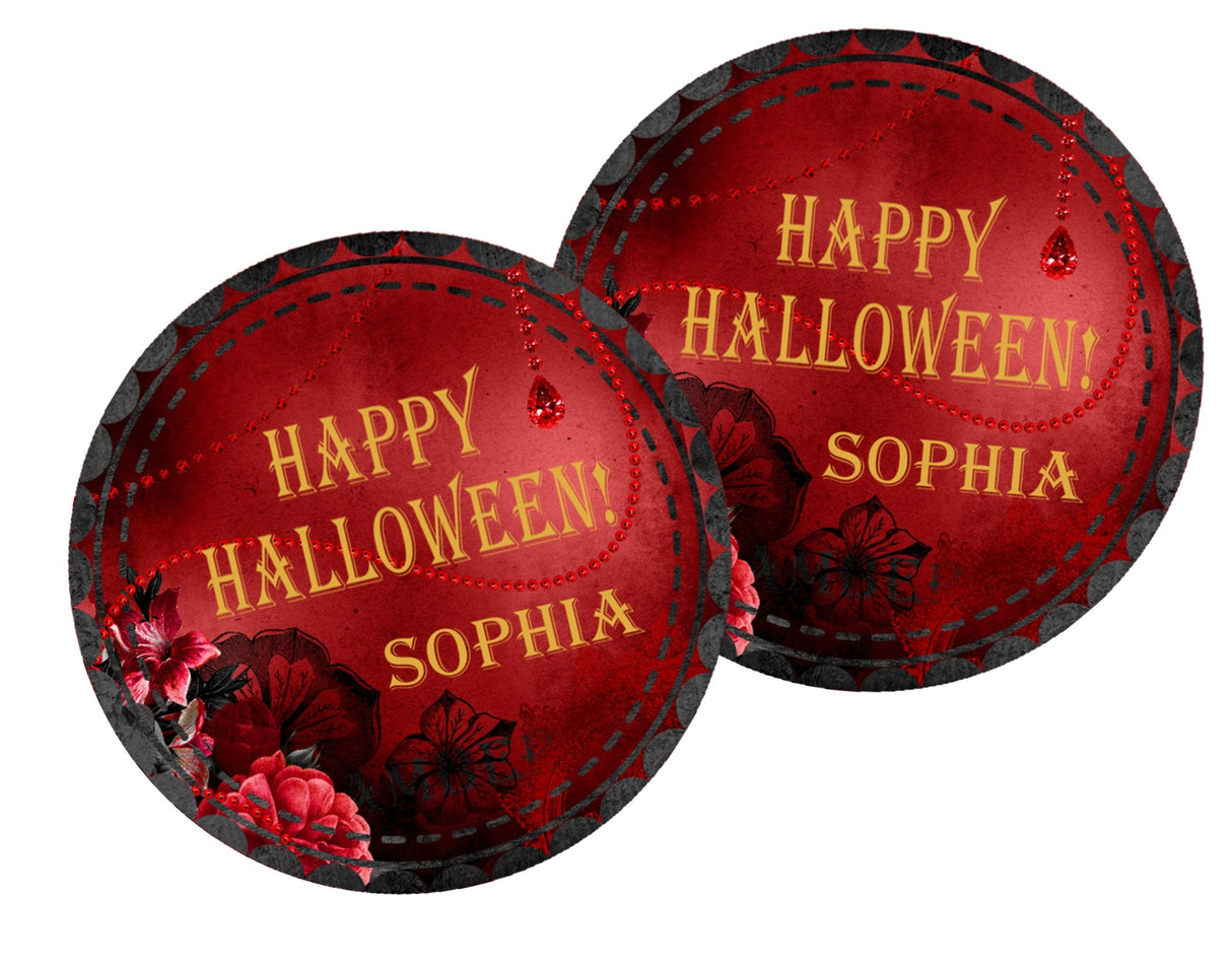 round halloween favor label featuring red florals and jewel inspired accents