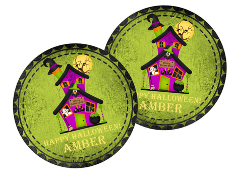 round halloween sticker showing haunted house illustration with spooky accents