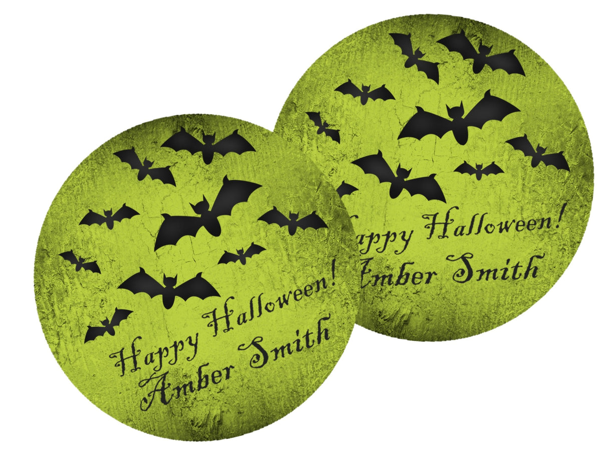 round spooky halloween favor label featuring flying bats and script lettering
