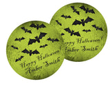 round spooky halloween favor label featuring flying bats and script lettering