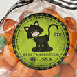 vintage halloween sticker featuring black cat illustration on green background
