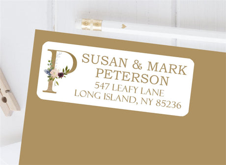Gold initial floral personalized address label on envelope