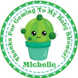 Green cactus baby shower stickers with smiling cactus design.