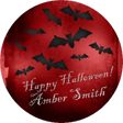 personalized halloween sticker with black bats flying across deep red background