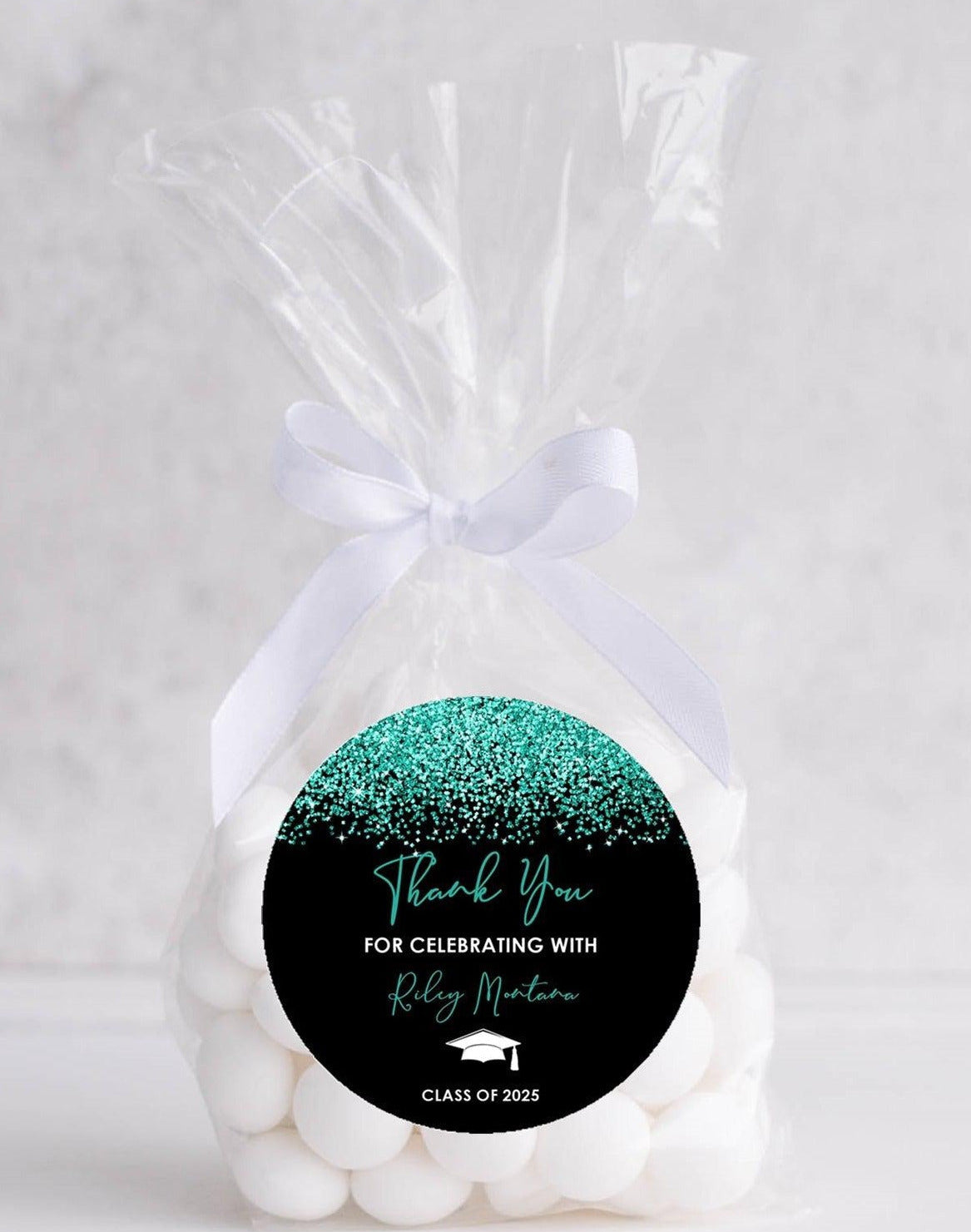 Turquoise and black graduation sticker on favor bag – party label example